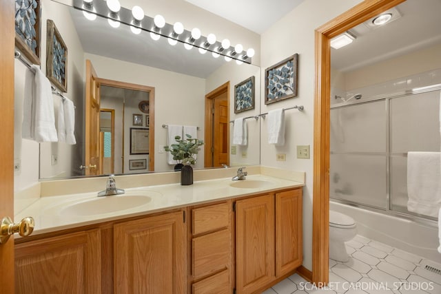 645 Rosewood Dr, West Chicago, IL 60185 - full bathroom with toilet, double vanity, and enclosed tub / shower combo
