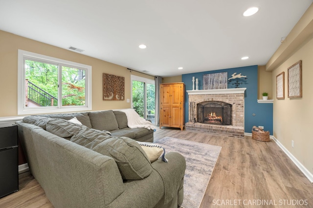645 Rosewood Dr, West Chicago, IL 60185 - living room with light wood-style floors, recessed lighting, a fireplace, and baseboards