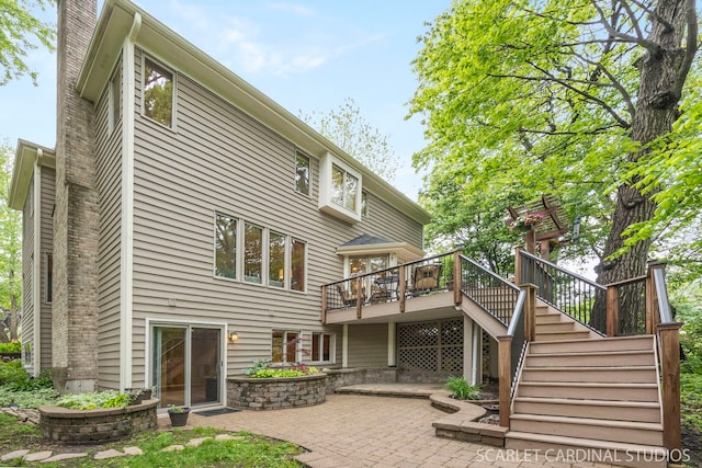 645 Rosewood Dr, West Chicago, IL 60185 - rear view of property with a patio, a wooden deck, stairway, and a chimney