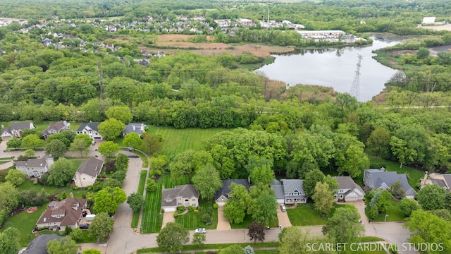 645 Rosewood Dr, West Chicago, IL 60185 - aerial overview of property's location featuring a nearby body of water, nearby suburban area, and a heavily wooded area