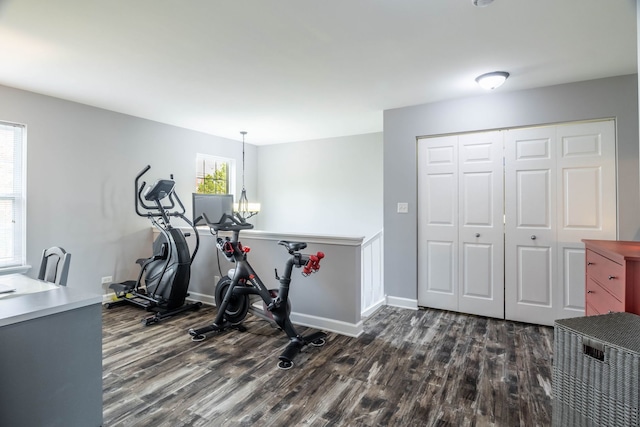 3052 Mosedale St, Elgin, IL 60124 - workout room with an inviting chandelier, baseboards, and dark wood-type flooring