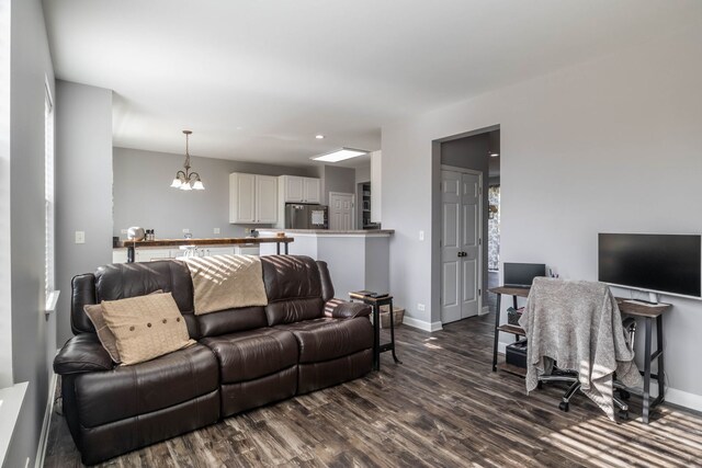 3052 Mosedale St, Elgin, IL 60124 - living area featuring dark wood-style flooring, baseboards, a chandelier, and recessed lighting