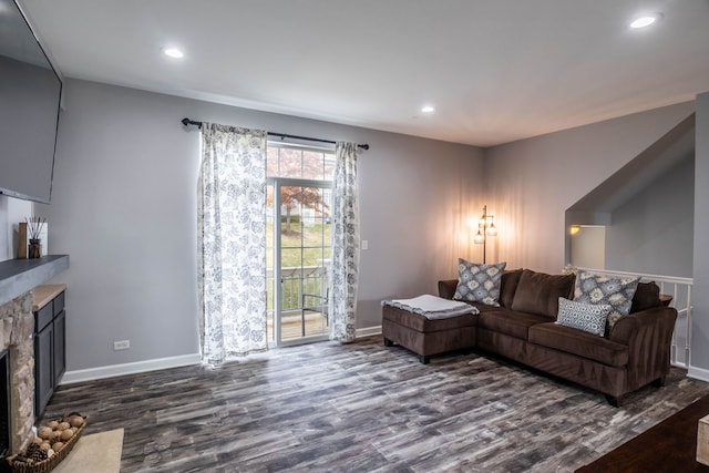 3052 Mosedale St, Elgin, IL 60124 - living room featuring a stone fireplace, recessed lighting, dark wood finished floors, and baseboards