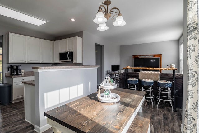 3052 Mosedale St, Elgin, IL 60124 - dining room featuring recessed lighting, dark wood-style floors, and a notable chandelier