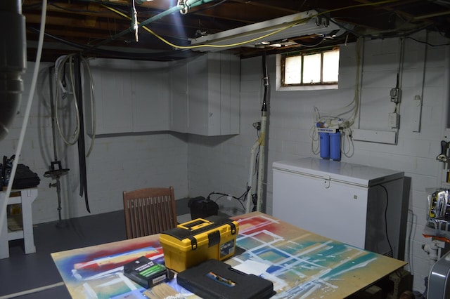 below grade area with concrete block wall
