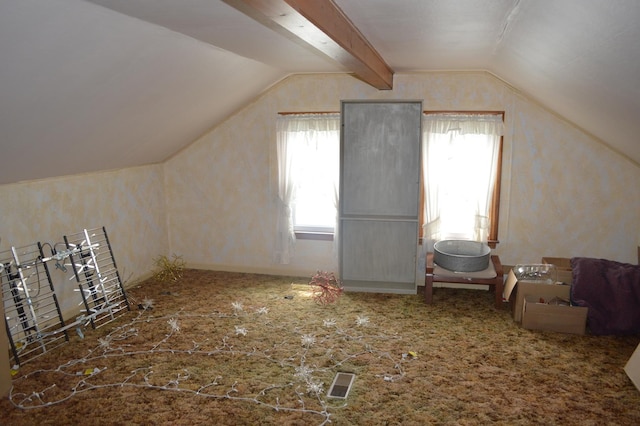 additional living space featuring vaulted ceiling