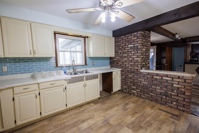 2214 N Bur Oak Ct, Bonfield, IL 60913 - kitchen with light countertops, ceiling fan, a sink, and brick wall