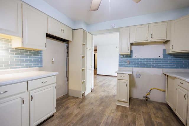 2214 N Bur Oak Ct, Bonfield, IL 60913 - kitchen featuring white cabinets, ceiling fan, light countertops, wood finished floors, and tasteful backsplash