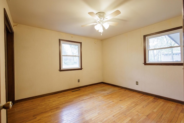 2214 N Bur Oak Ct, Bonfield, IL 60913 - unfurnished room with a ceiling fan, baseboards, visible vents, and light wood finished floors