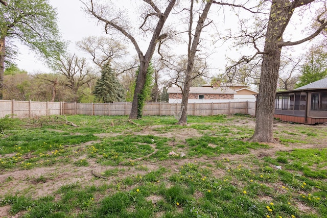 2214 N Bur Oak Ct, Bonfield, IL 60913 - view of yard featuring a fenced backyard and a sunroom