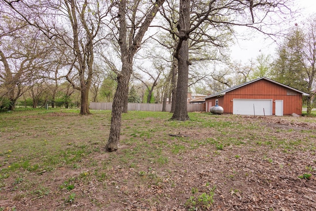 2214 N Bur Oak Ct, Bonfield, IL 60913 - view of yard featuring fence, an outdoor structure, and a garage