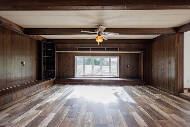 2214 N Bur Oak Ct, Bonfield, IL 60913 - unfurnished living room featuring beamed ceiling, wood walls, and wood finished floors