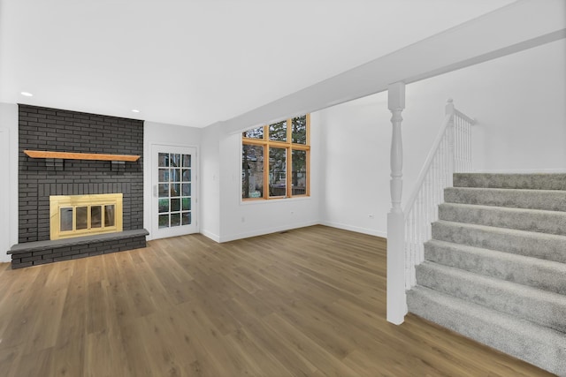 17247 Lakebrook Dr, Orland Park, IL 60467 - unfurnished living room featuring stairs, a brick fireplace, wood finished floors, baseboards, and recessed lighting