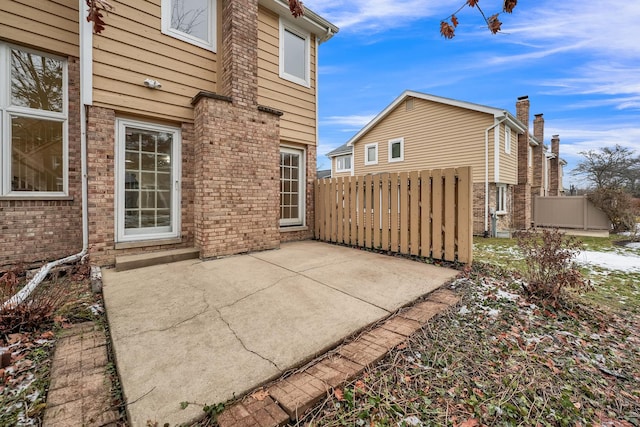 17247 Lakebrook Dr, Orland Park, IL 60467 - exterior space featuring brick siding, a patio area, and fence