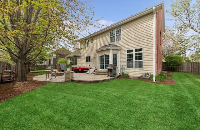 385 N Chalary Ct, Palatine, IL 60067 - back of house with a patio area, a fenced backyard, an outdoor fire pit, a yard, and entry steps