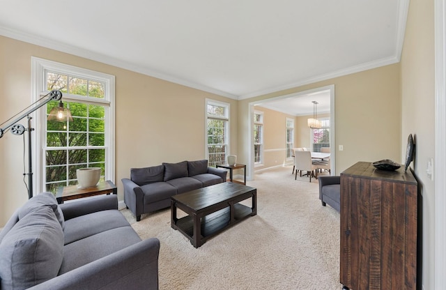 385 N Chalary Ct, Palatine, IL 60067 - living area featuring crown molding, an inviting chandelier, plenty of natural light, and light colored carpet