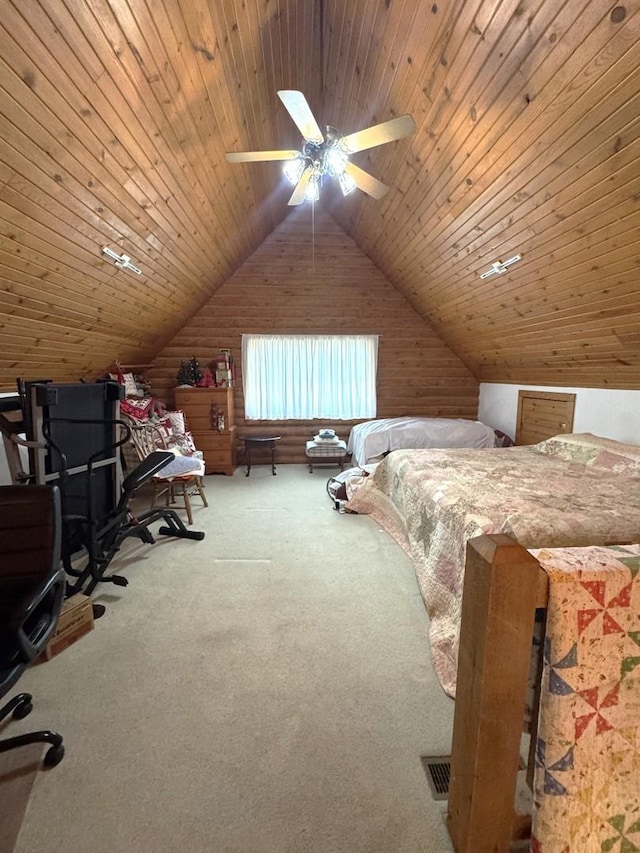 carpeted bedroom with wooden walls, vaulted ceiling, and wood ceiling