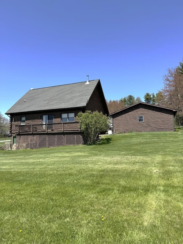 exterior space with a yard and a deck