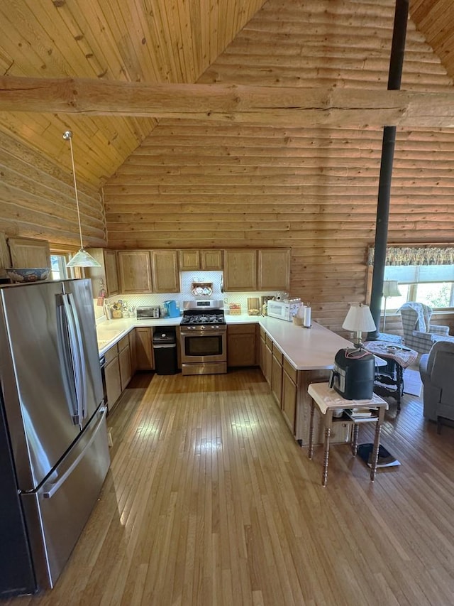 kitchen with light countertops, high vaulted ceiling, appliances with stainless steel finishes, and wooden ceiling