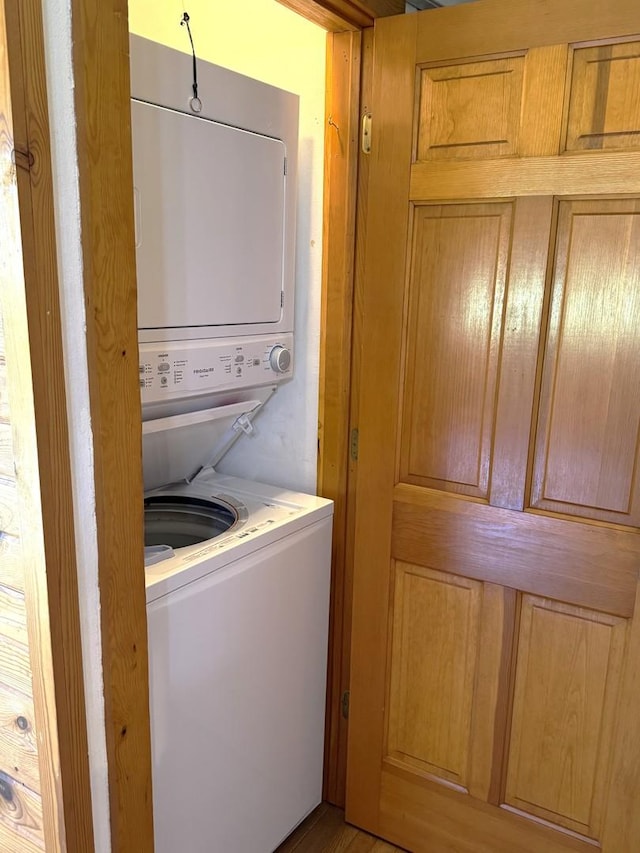laundry area with laundry area and stacked washer and dryer