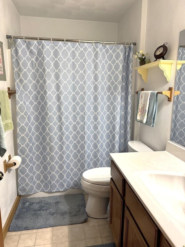 full bathroom with toilet, a shower with shower curtain, tile patterned flooring, and vanity