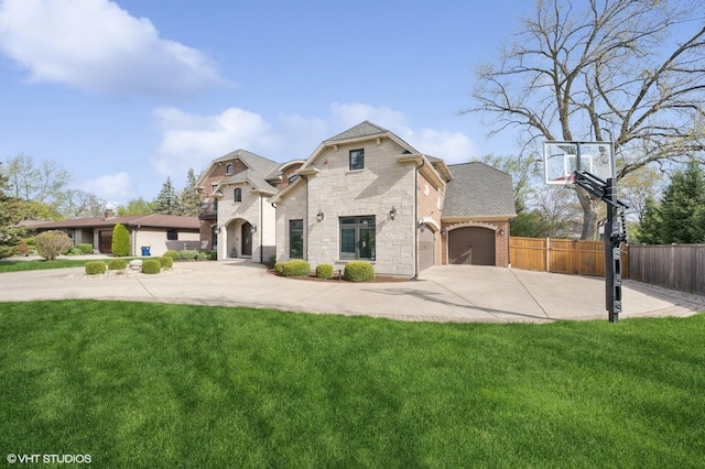3244 Lakeside Ave, Northbrook, IL 60062 - view of front of home with a garage, fence, stone siding, a front yard, and driveway