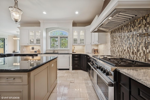 3244 Lakeside Ave, Northbrook, IL 60062 - kitchen with tasteful backsplash, high end stainless steel range, dark stone countertops, stone tile flooring, and custom range hood