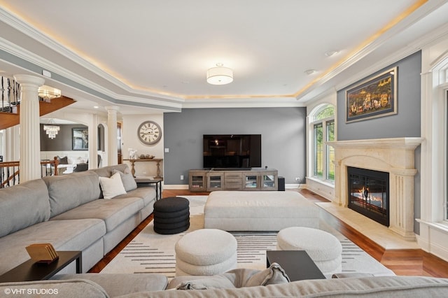 3244 Lakeside Ave, Northbrook, IL 60062 - living room with decorative columns, wood finished floors, baseboards, a tray ceiling, and a premium fireplace