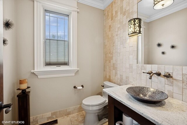 3244 Lakeside Ave, Northbrook, IL 60062 - half bathroom featuring tile walls, ornamental molding, vanity, and toilet