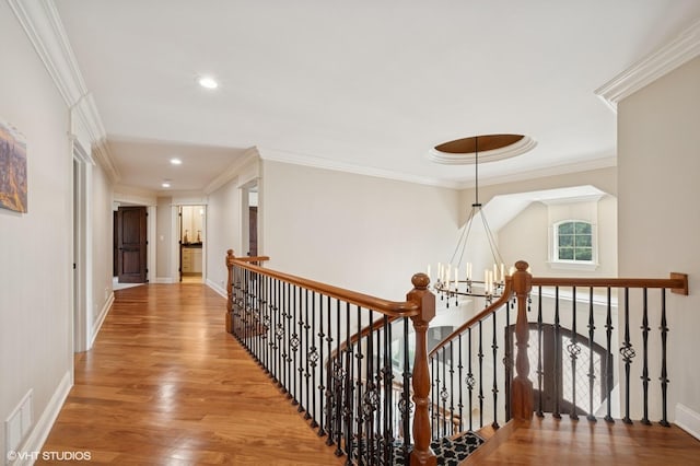 3244 Lakeside Ave, Northbrook, IL 60062 - hall featuring visible vents, wood finished floors, baseboards, an upstairs landing, and ornamental molding