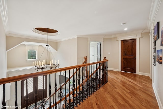 3244 Lakeside Ave, Northbrook, IL 60062 - hall featuring crown molding, a chandelier, baseboards, an upstairs landing, and wood finished floors