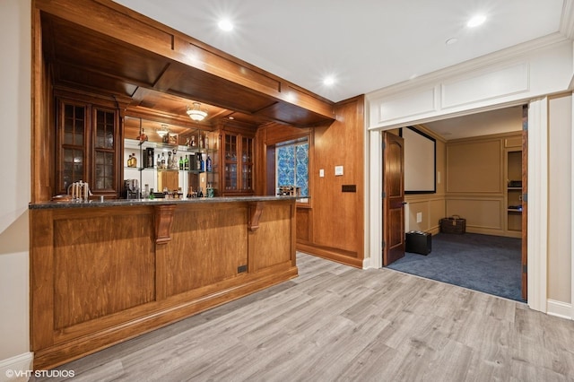 3244 Lakeside Ave, Northbrook, IL 60062 - bar featuring baseboards, indoor wet bar, light wood-style floors, ornamental molding, and a decorative wall