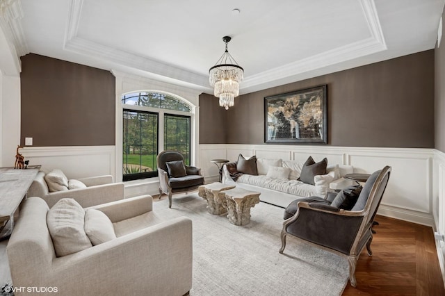 3244 Lakeside Ave, Northbrook, IL 60062 - living area with a raised ceiling, a decorative wall, wainscoting, and a notable chandelier