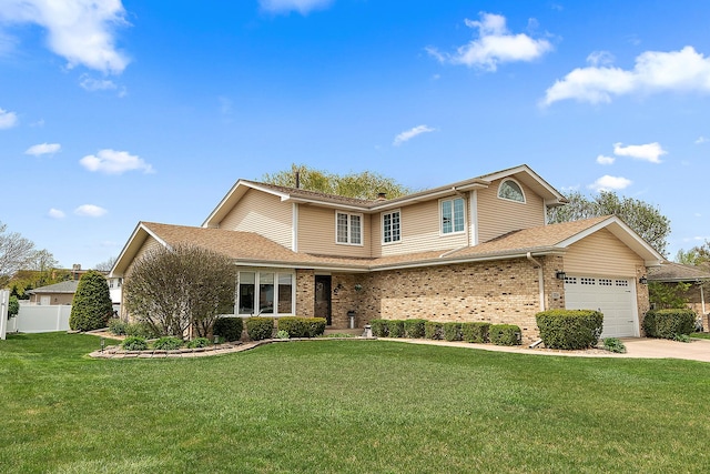 17130 Inverness Dr, Tinley Park, IL 60487 - traditional-style home with a garage, a front lawn, fence, brick siding, and concrete driveway