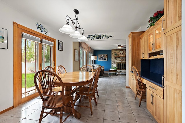 17130 Inverness Dr, Tinley Park, IL 60487 - dining area featuring baseboards, a ceiling fan, light tile patterned flooring, and a fireplace
