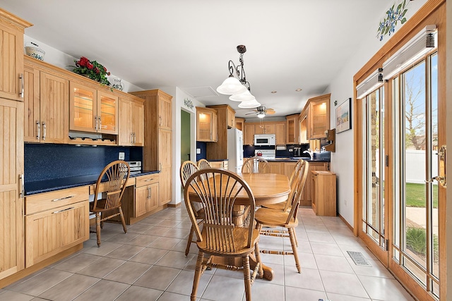 17130 Inverness Dr, Tinley Park, IL 60487 - dining room with built in study area, light tile patterned floors, and visible vents