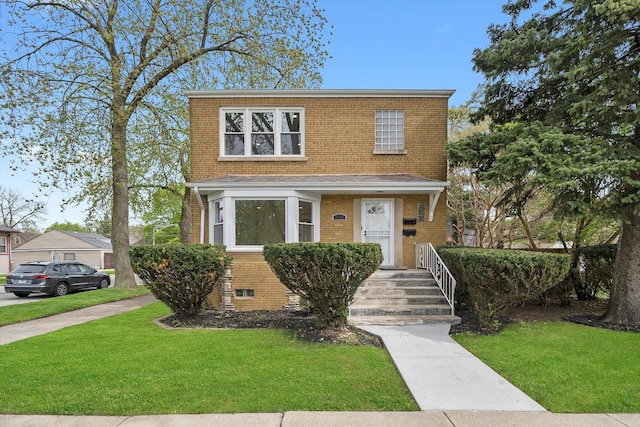 view of front of property featuring brick siding and a front yard