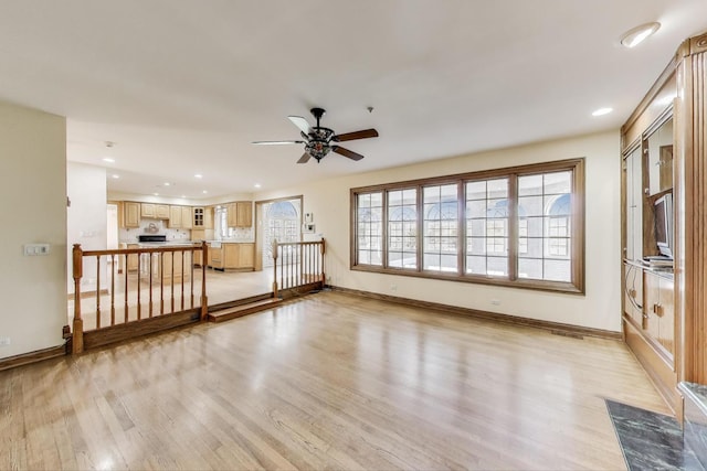 2125 Harrow Gate Dr, Inverness, IL 60010 - unfurnished living room featuring a ceiling fan, baseboards, recessed lighting, and light wood-style floors
