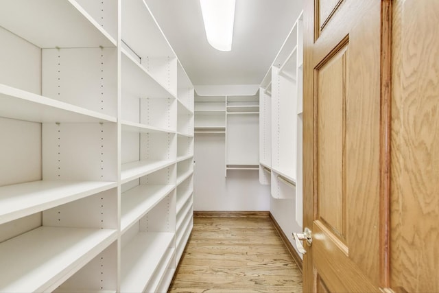 2125 Harrow Gate Dr, Inverness, IL 60010 - spacious closet featuring light wood finished floors