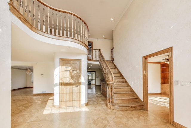 2125 Harrow Gate Dr, Inverness, IL 60010 - stairs with crown molding, baseboards, recessed lighting, and a towering ceiling