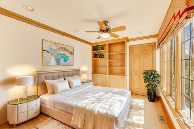 2125 Harrow Gate Dr, Inverness, IL 60010 - bedroom with visible vents, wood finished floors, and multiple windows