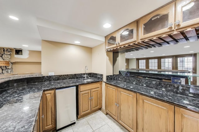2125 Harrow Gate Dr, Inverness, IL 60010 - kitchen with a sink, dark stone counters, glass insert cabinets, brown cabinets, and recessed lighting