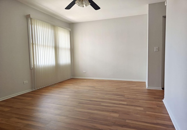 1572 Brandywyn Ln, Buffalo Grove, IL 60089 - spare room featuring baseboards, ceiling fan, and wood finished floors