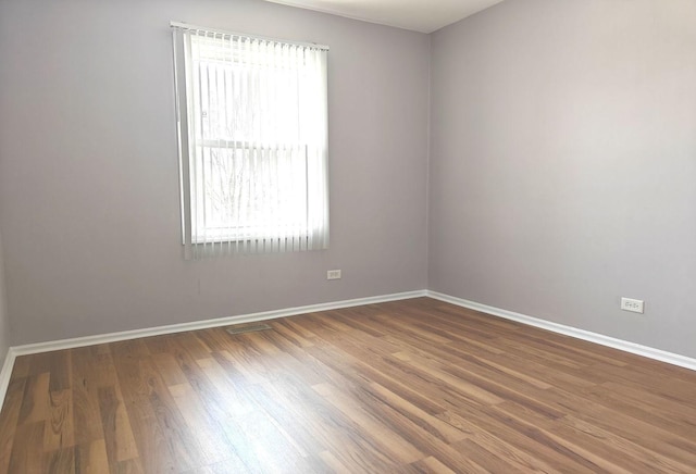 1572 Brandywyn Ln, Buffalo Grove, IL 60089 - empty room featuring baseboards, wood finished floors, and visible vents