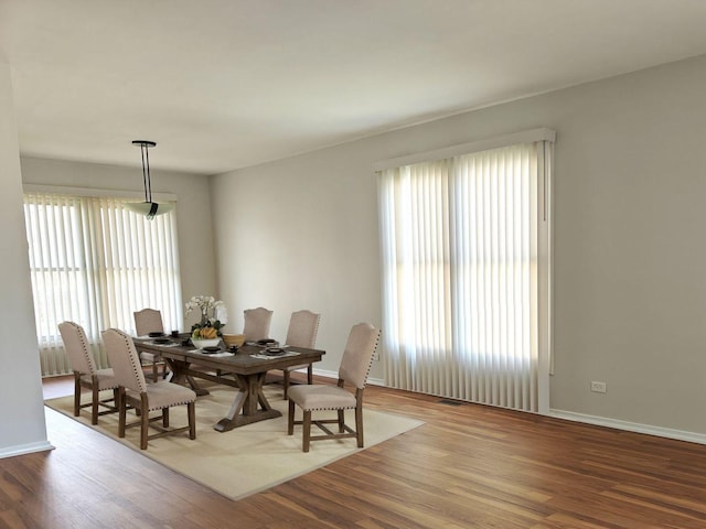 1572 Brandywyn Ln, Buffalo Grove, IL 60089 - dining space with baseboards, a healthy amount of sunlight, and wood finished floors