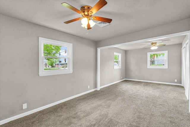902 N Lincoln Ave, Urbana, IL 61801 - empty room with ceiling fan, carpet floors, and baseboards