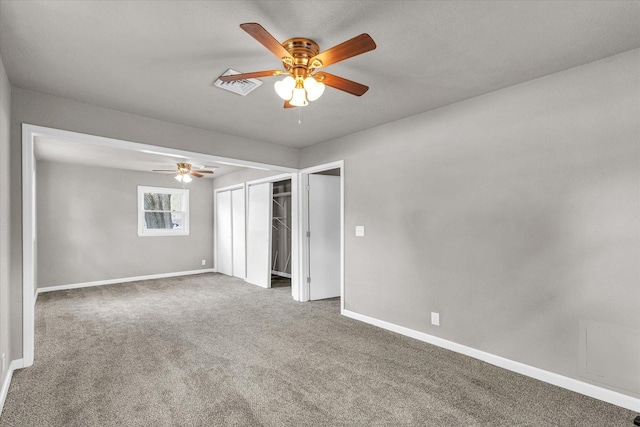 902 N Lincoln Ave, Urbana, IL 61801 - unfurnished bedroom with carpet floors, a closet, baseboards, and a ceiling fan