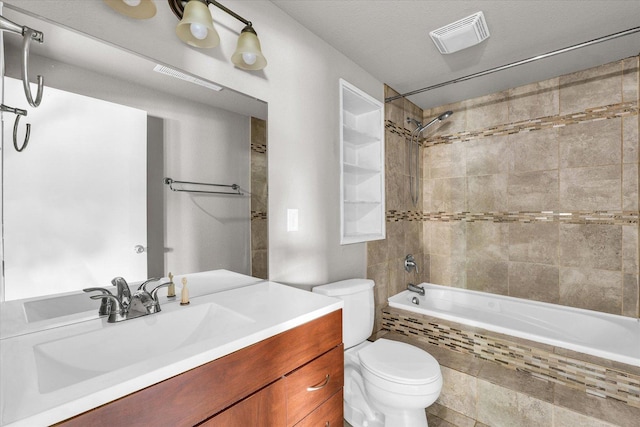 902 N Lincoln Ave, Urbana, IL 61801 - full bath featuring toilet, tiled shower / bath combo, and vanity