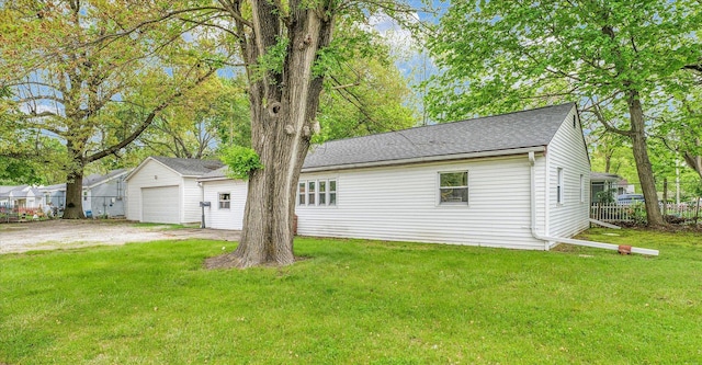 902 N Lincoln Ave, Urbana, IL 61801 - rear view of house featuring roof with shingles and a detached garage