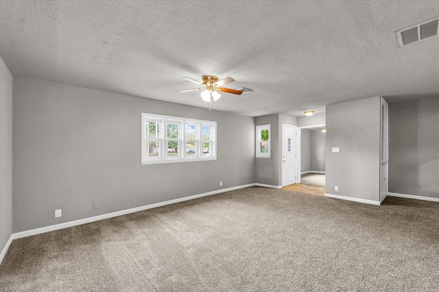 902 N Lincoln Ave, Urbana, IL 61801 - carpeted spare room with ceiling fan, baseboards, and a textured ceiling